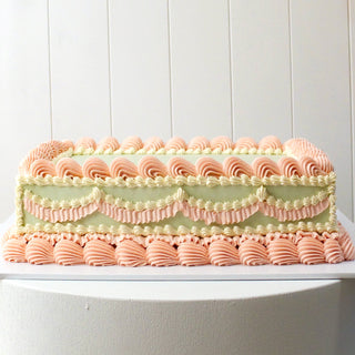 sheet cake in sage, pink, and white colours